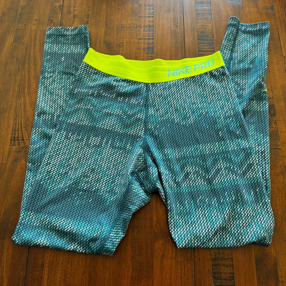 Nike Women's Teal Patterned Leggings with Neon Yellow Waistband